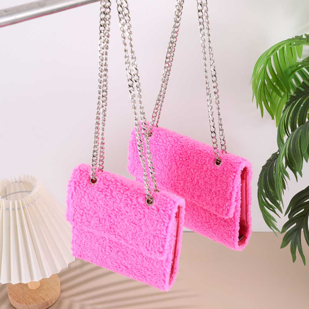 Hot pink sherpa Teddy Wallet Set in A6 and A7 sizes hanging by silver chain straps showing the soft fluffy texture