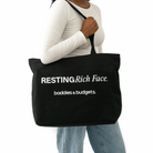 Black woman wearing gold jewelry and holding a bold statement canvas tote from Baddies & Budgets