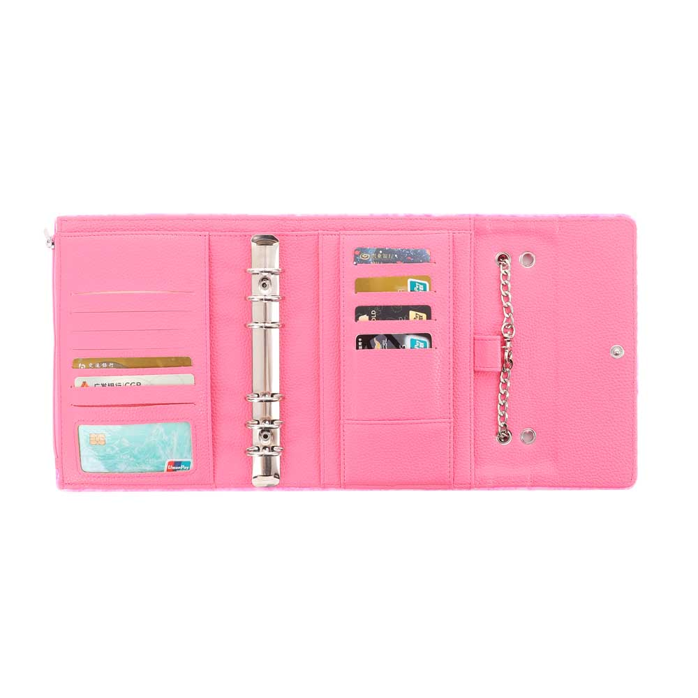 Inside view of the trifold teddy wallet showing pink vegan leather interior with multiple card slots, 6-ring binder, and detachable silver chain attachment